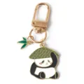 Detailed view of a cute enamel panda keychain with a green bamboo leaf charm and gold clasp. - G-1523 -2