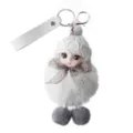 Detailed close-up shot of a cute white plush doll keychain with knitted hat and grey bow. - White
