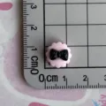 Detailed view of miniature black and pink resin bow charm for phone case DIY craft. - Lace Round Bow Tie / Mini Size / Black and Pink Color Scheme