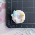 Resin donut DIY accessory detail shot, cute food charm with blue flower and yellow blossoms. - Nude Pink Blessing Word & Flower Donut (09)
