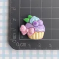 Resin purple cupcake cabochon charm with pink bow for DIY jewelry making and craft decor. - Purple Blueberry Pink Bowknot Cake