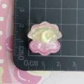 Pink resin shell moon charm detail shot showing size on grid mat for DIY phone case craft. - Glittering Pink Yellow Moon Shell