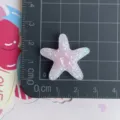 Accessoire en résine étoile de mer pailletée translucide, idéal pour les loisirs créatifs. - Étoile De Mer Dégradée À Paillettes Rose Clair