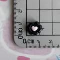 Close-up detail of a miniature black resin charm featuring a cute pink heart design. - Heart Cloud Dialogue Box / Mini Size / Black and Pink Color Scheme