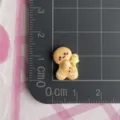 Resin gingerbread man charm detail view, showing size and texture clearly for DIY crafts. - Small-Star Gingerbread Man (F061)