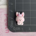 Close-up detail of cute pink rabbit resin charm with tiny party hat for DIY craft accessories. - Pink Rabbit (04)