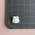 Close up of cute white rabbit resin charm with pink heart ears, ideal for DIY nail art and crafts. - White Heart Rabbit / Mini Pack