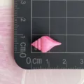 Mini pink resin conch seashell charm detail view, perfect for DIY phone case and crafts. - Pointed Conch / Rose Red