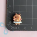 Resin capybara charm detail showing size on grid, cute DIY crafting accessory for phone case. - Hula Dance Capybara / Mini