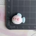 Detailed close-up of cute resin fish charm in pink and blue, perfect for DIY craft and accessories. - Blue Pink White Smiling Fish