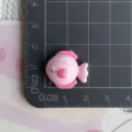 Close up of cute pink fish resin cabochon craft accessory, perfect for DIY decoration. - Pink Heart Fish