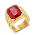 Close-up of a gold-toned men's Freemasonry ring featuring a large red gemstone. - Size 7 / Red