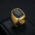 Close-up of a men's business style gold-plated stainless steel ring with black zircon - Size 7 / Black