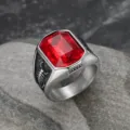 Close-up of men's titanium steel ring with red gemstone and scorpion engraving - Size 7 / Red Zircon