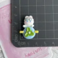 Resin little rabbit flatback charm detail shot showing cute cartoon design and exact size scale. - Rabbit in Blue Propeller Plane