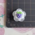 Detailed view of glossy resin grape flower DIY accessory showing size on cutting mat. - Transparent Grape Flower Cake (No.2)