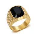 Detail view of a men's gold stainless steel ring with a large rectangular black stone. - Size 7 / Black