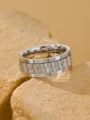 Close-up detail of men's stainless steel spinner ring with watch band texture - Size 8 / Steel