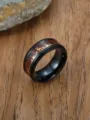 Macro detail of men's stainless steel ring with wood inlay and deer silhouette - Size 7 / Gold