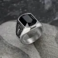 Detail view of men's titanium steel ring with black gemstone and scorpion carving - Size 7 / Black Zirconia