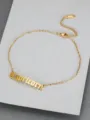 Detail of gold titanium steel anklet featuring Capricorn in Old English font - Capricorn