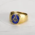 Detailed macro view of a vintage gold Freemasonry ring with blue enamel and G symbol - Size 7 / Gold & Blue