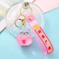 Pink liquid quicksand lucky cat keychain with strap, cute acrylic car key ring pendant. - Pink