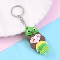 Cute cartoon girl keychain with frog hat, soft PVC bag charm and metal keyring pendant. - Snake