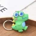 Porte-clés dinosaure de dessin animé mignon en caoutchouc souple pendentif sac pour femmes. - Vert clair