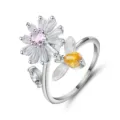Close-up of adjustable silver daisy and bee ring with sparkling pink and yellow stones - Open Adjustable / Pink