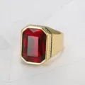 Close-up of a men's gold titanium steel ring with a large red square gemstone - Size 7 / Red