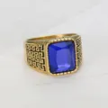 Close-up detail of a men's hip hop style square blue gemstone ring in gold finish - Size 7 / Blue