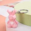 Pink geometric rabbit keychain, cute PVC soft rubber animal pendant for bags and car keys. - Rabbit