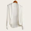Detailed view of the white batwing sleeve knit cardigan, lightweight fabric, elegant drape. - Tops / 160cm / White