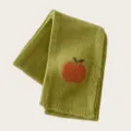 Green knitted scarf detail featuring a cute orange apple pattern, warm winter wool accessory. - Mustard Green