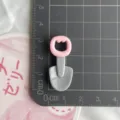 Resin shovel craft accessory detail view, cute pink cat head handle for DIY phone case decor. - Iron Shovel Glossy Style