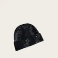 Close-up view of the wool blend speckled knit beanie showing detailed soft winter fabric texture. - One Size / Black