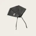 Close-up of black and white striped knitted triangle headscarf fabric and brand label detail. - Black