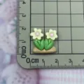 Detailed macro shot of miniature resin dual-flower green leaves craft accessory for DIY decor. - Double Flower Shape / Beige