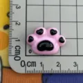 Pink and black cat paw resin charm close up, perfect for DIY cream glue phone case crafts. - Black Pink Cat Paw