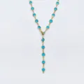 Collana a Y color oro con pietre di vetro rotonde incastonate in vivace colore blu. - Blu lago