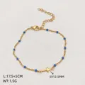 Stainless steel gold chain bracelet with blue beads and cross pendant, adjustable size. - Cross Pendant Style / Gold