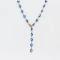 Detailed closeup of the stainless steel evil eye Y-shaped necklace with blue and white beads. - Steel / Blue