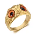 Detailed close-up of a vintage gold owl eye stainless steel ring in a punk gothic style - Size 7 / Gold Orange