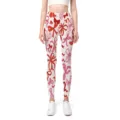 Detailed view of seamless high-waist yoga pants with red bow print and peach hip lift - Bow