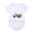 White newborn baby bodysuit featuring a cute blue truck and pumpkin print detail view - Style 12