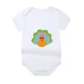 White short-sleeve baby bodysuit featuring a colorful cartoon turkey graphic print. - Style 13