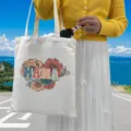 Detailed view of the MAMA floral print on a durable white canvas tote shopping bag - Style 10