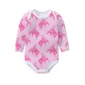 Close-up detail of pink long sleeve baby bodysuit with repeating cowboy horse pattern - 3m / Pink Denim