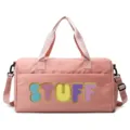 Close-up of a pink large capacity gym bag with colorful chenille STUFF letter embroidery - Pink